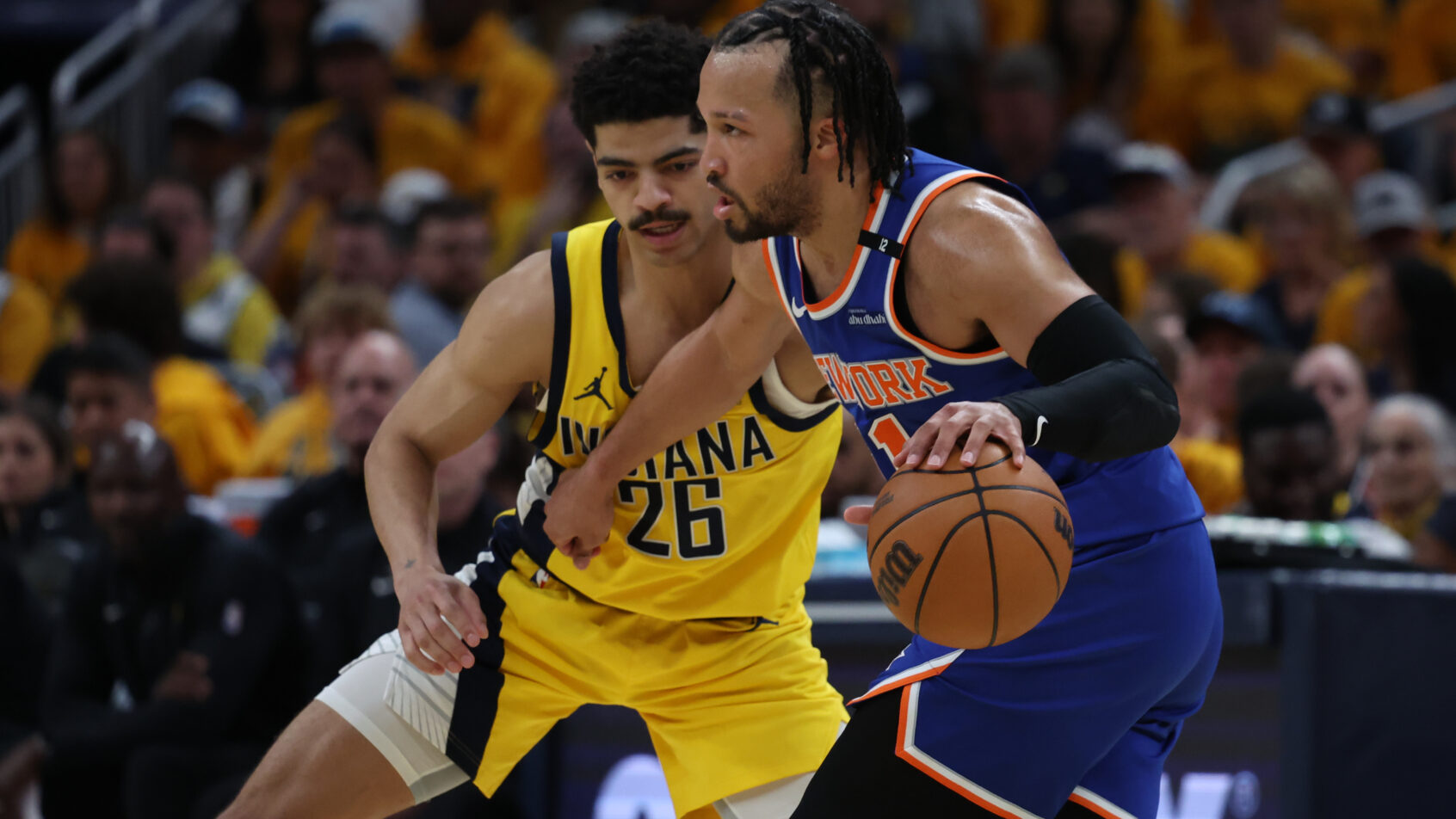 New York Knicks guard Jalen Brunson dribbles while Indiana Pacers guard Ben Sheppard defends