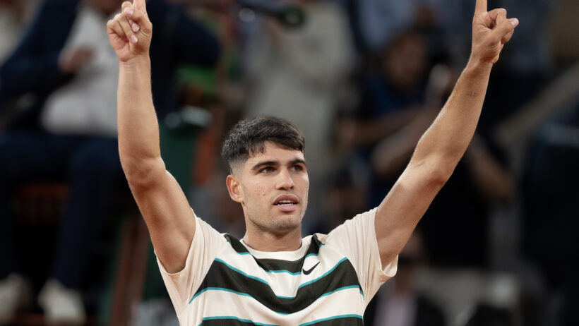 Carlos Alcaraz celebrates after his second round victory at Roland Garros.