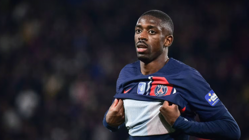 PSG soccer player Ousmane Dembele pulling his shirt up towards his chest.