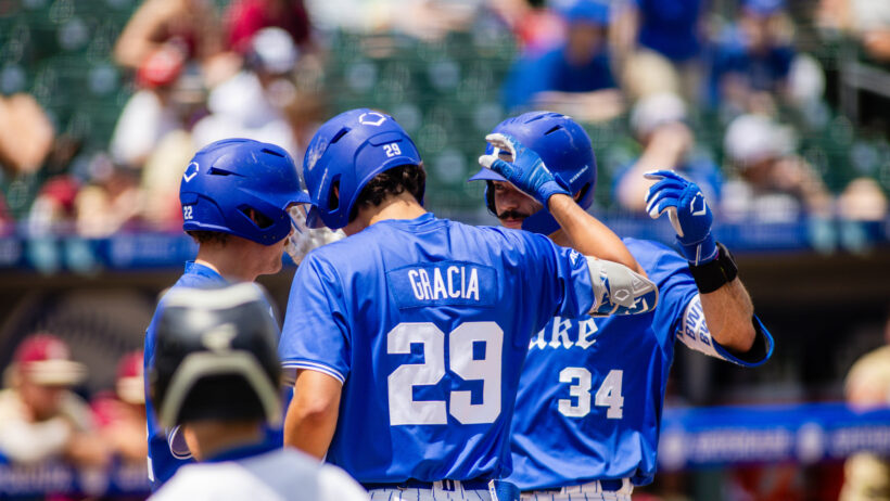 Ben Miller celebrates at home plate with his Duke teammates.