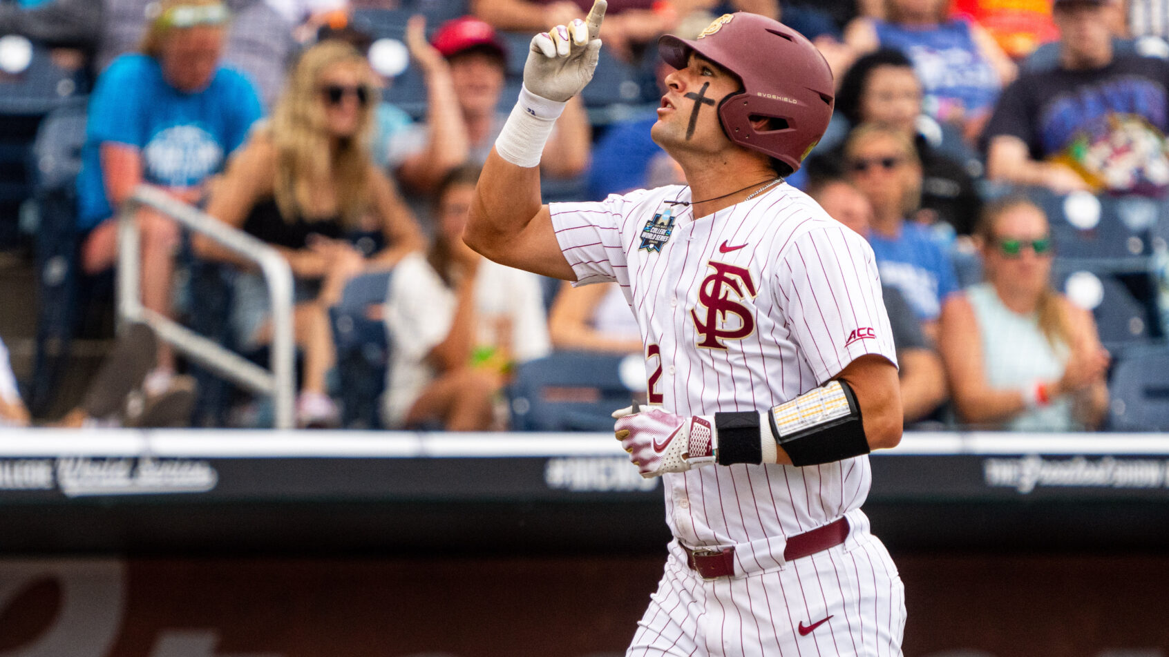 Daniel Cantu points to the sky as he crosses home plate after a home run versus Tennessee.