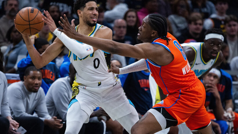 Tyrese Haliburton is guarded aggressively by Jalen Williams.