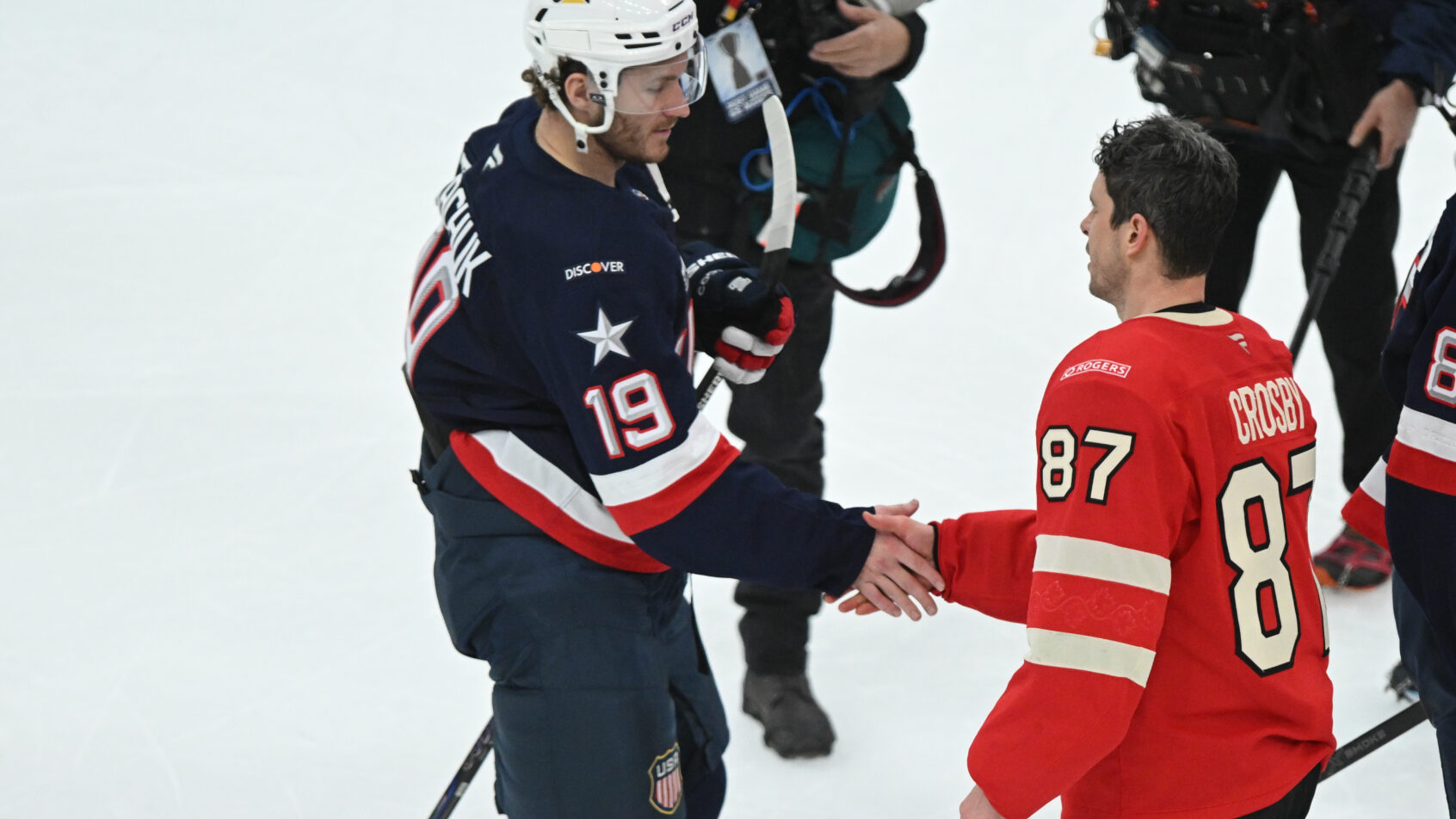 Team USA forward Matthew Tkachuk shakes hands with Team Canada forward Sidney Crosby