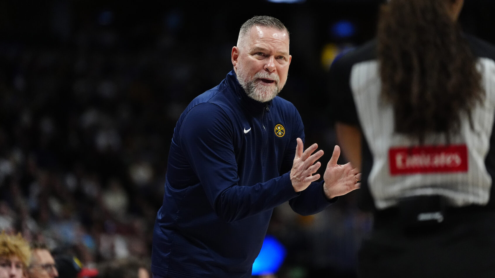 Denver Nuggets head coach Michael Malone clapping on the sideline