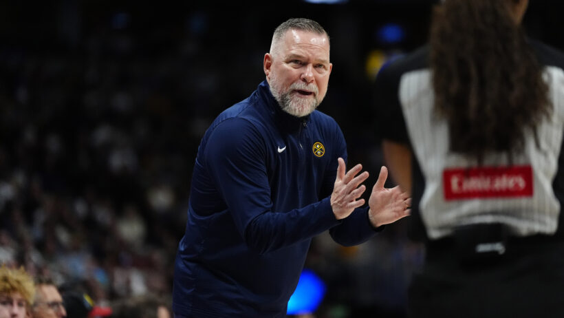Denver Nuggets head coach Michael Malone clapping on the sideline