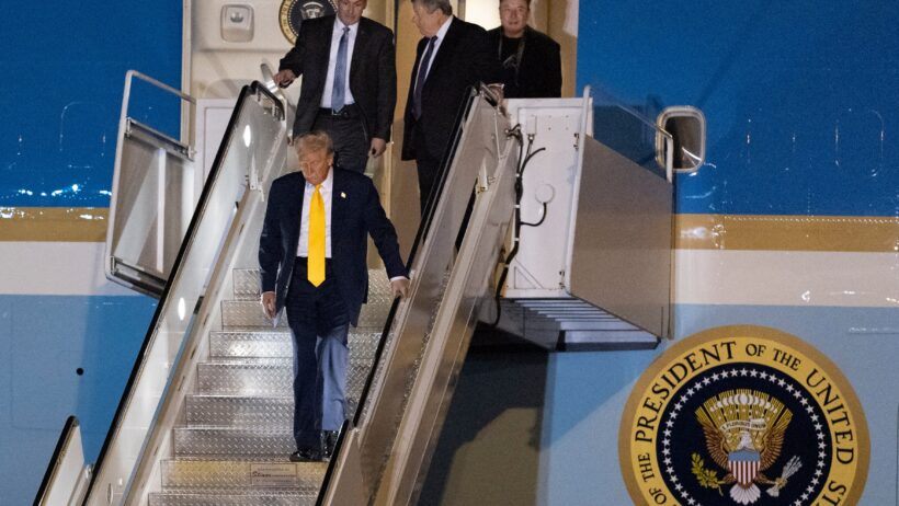 President Donald Trump exits Air Force One with Elon Musk