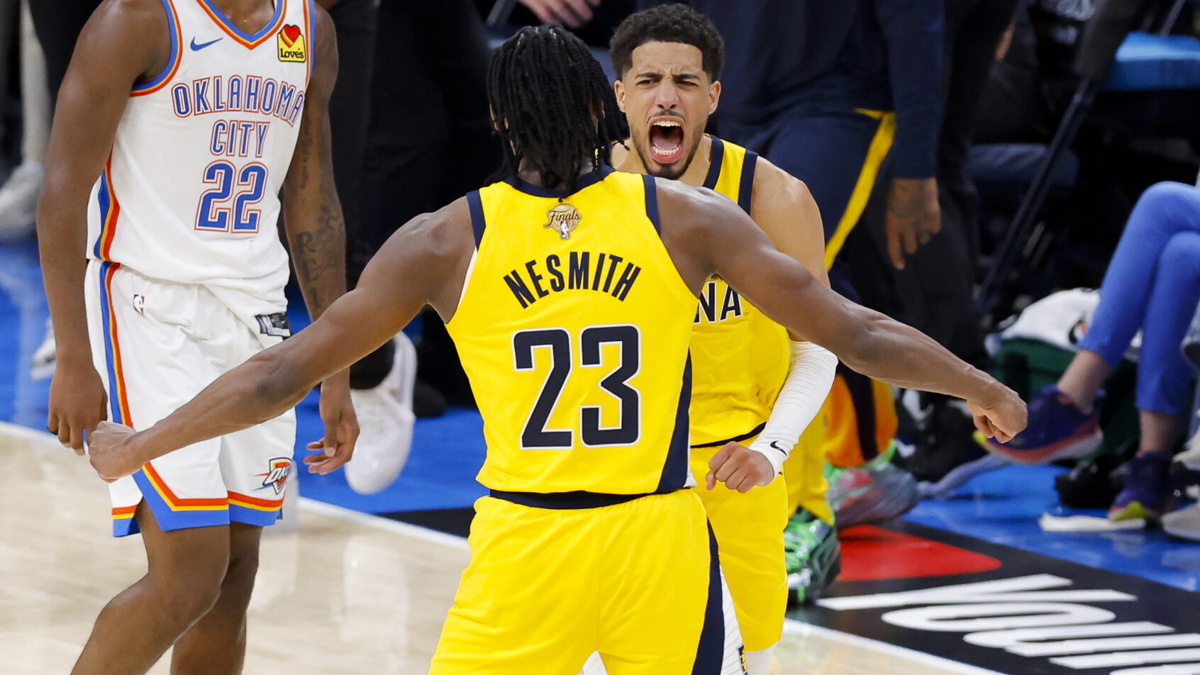 Tyrese Haliburton celebrating with Pacers teammate Aaron Nesmith
