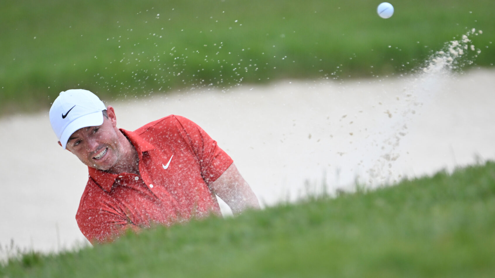 Rory McIlroy hitting a bunker shot