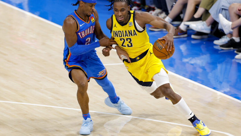 Indiana Pacers forward Aaron Nesmith drives around Oklahoma City Thunder guard Shai Gilgeous-Alexander