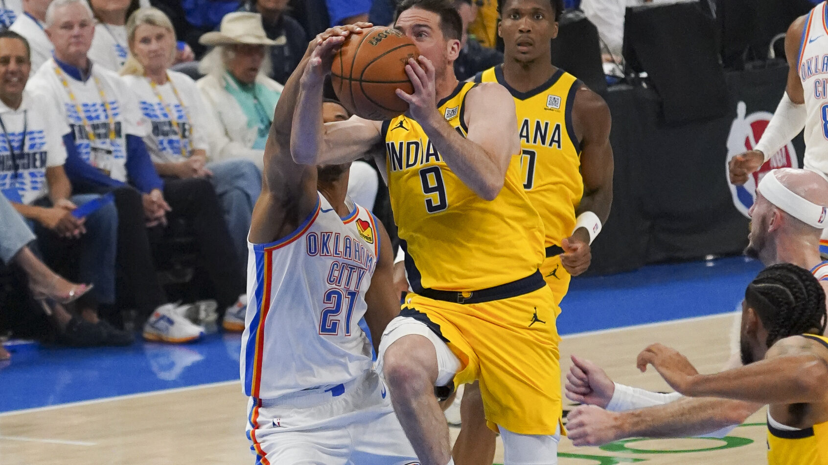 Indiana Pacers guard T.J. McConnell goes up for a shot as Oklahoma City Thunder guard Aaron Wiggins defends