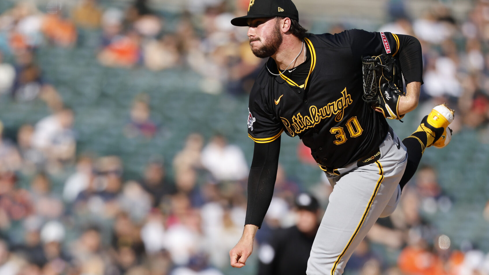 Pittsburgh Pirates pitcher Paul Skenes following through on a pitch