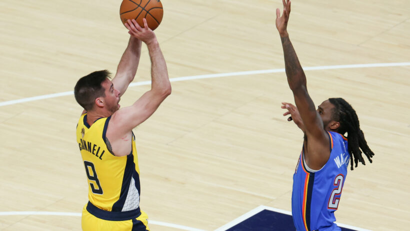 Indiana Pacers guard T.J. McConnell shooting over Oklahoma City Thunder guard Cason Wallace