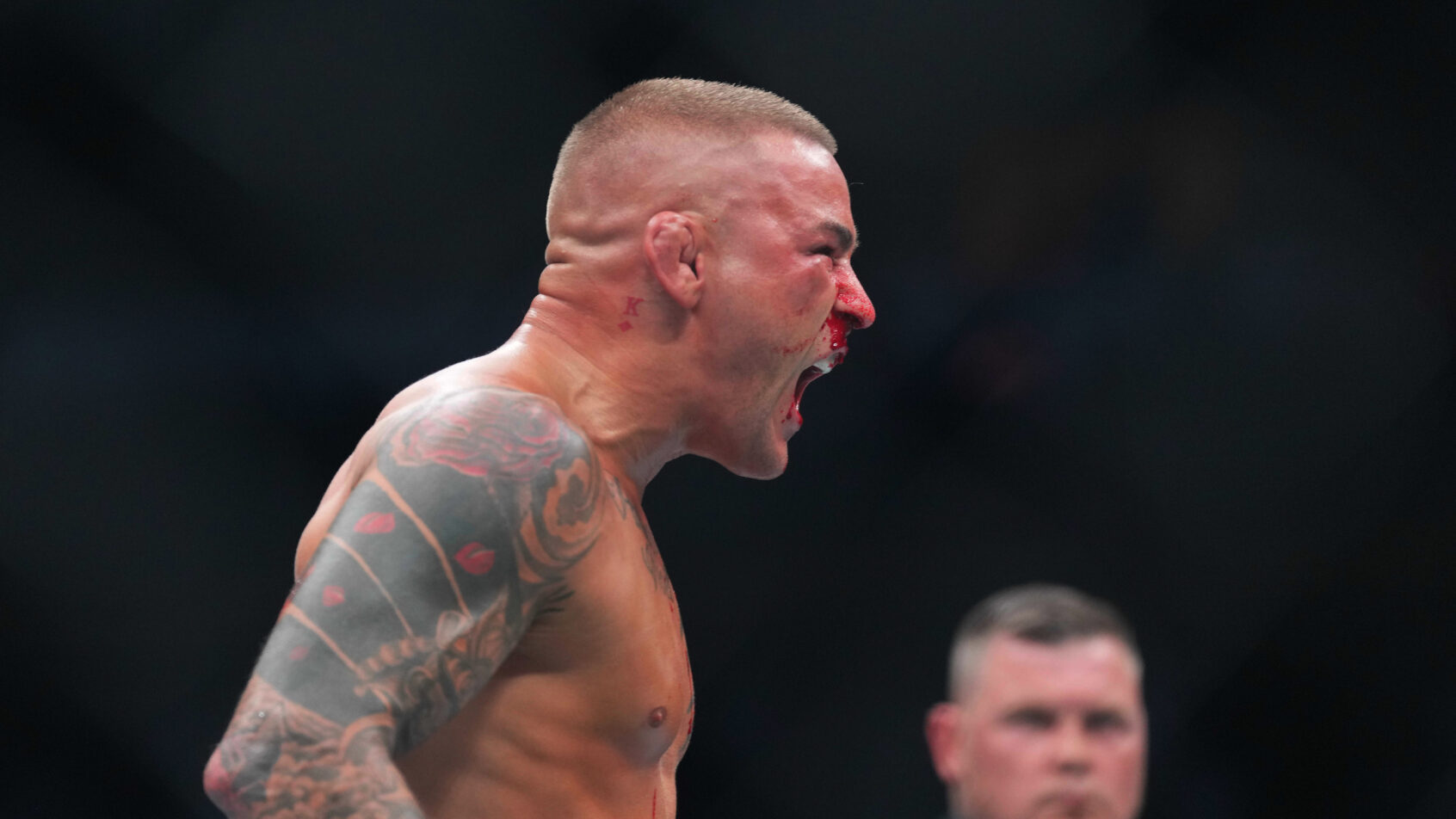 Dustin Poirier reacts during a fight
