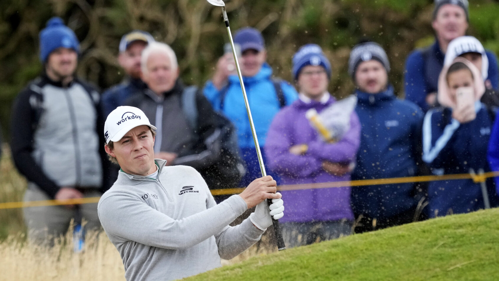 Matt Fitzpatrick splashes out of a bunker at the 152nd Open Championship.