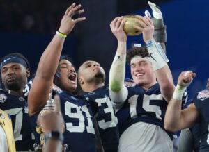 Penn State Nittany Lions teammates Drew Allar and Dvon J-Thomas celebrate