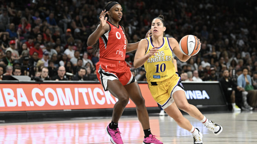 Los Angeles Sparks guard Kelsey Plum drives around Las Vegas Aces guard Jackie Young