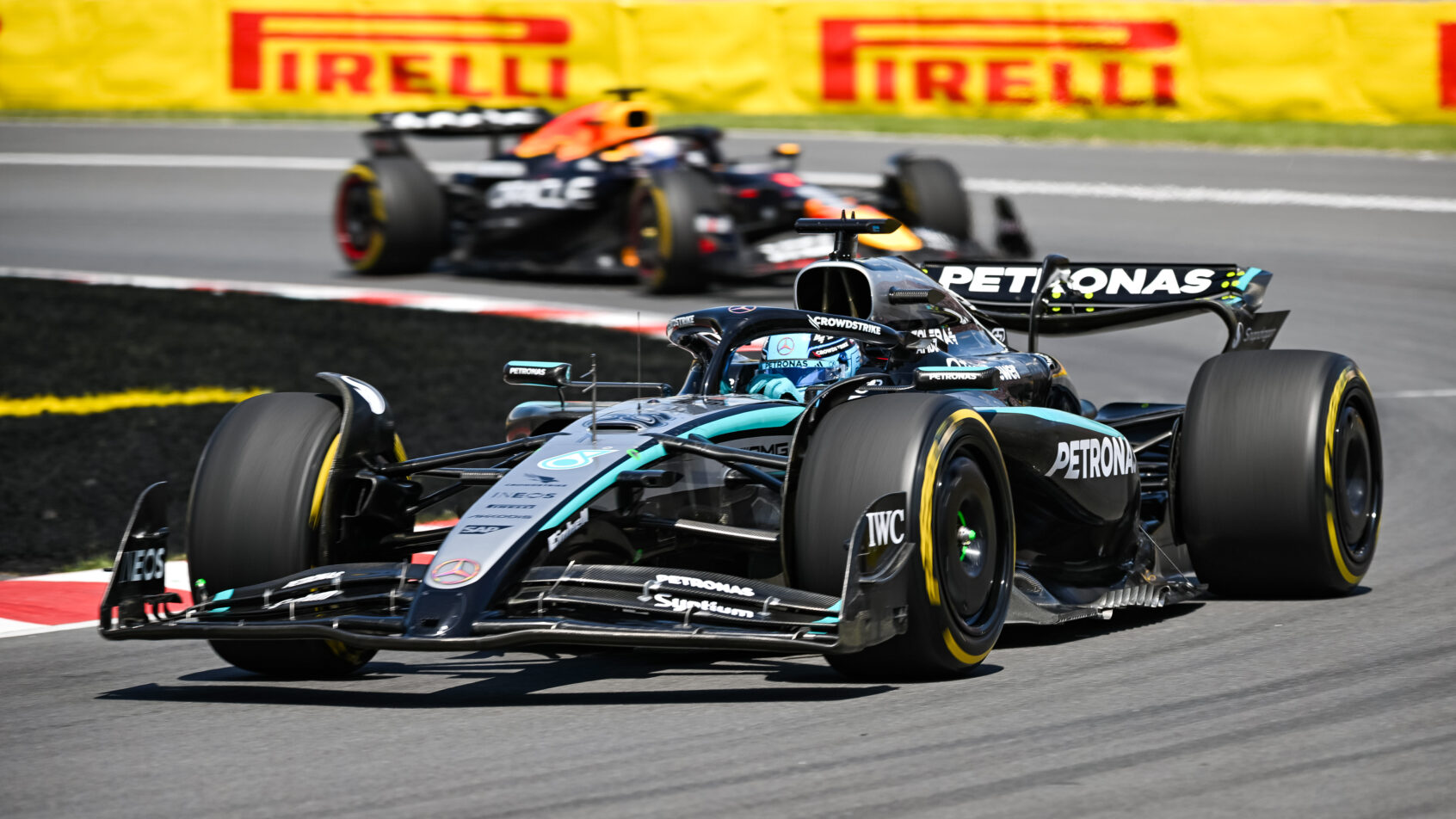 George Russell leads Max Verstappen in the Canadian Grand Prix (2025).