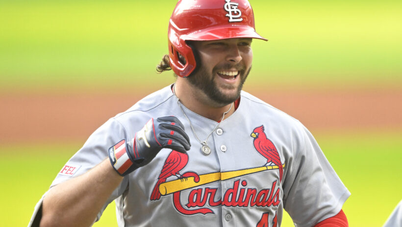 Alec Burleson smiling after hitting a home run