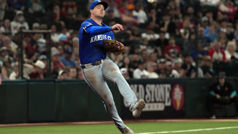 Kansas City Royals third baseman Nick Loftin throwing to first base