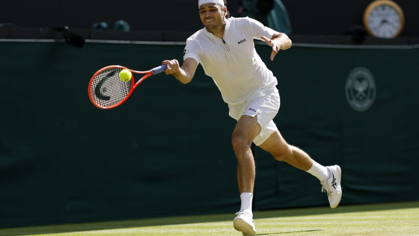 Taylor Fritz hitting a forehand at Wimbledon 2025