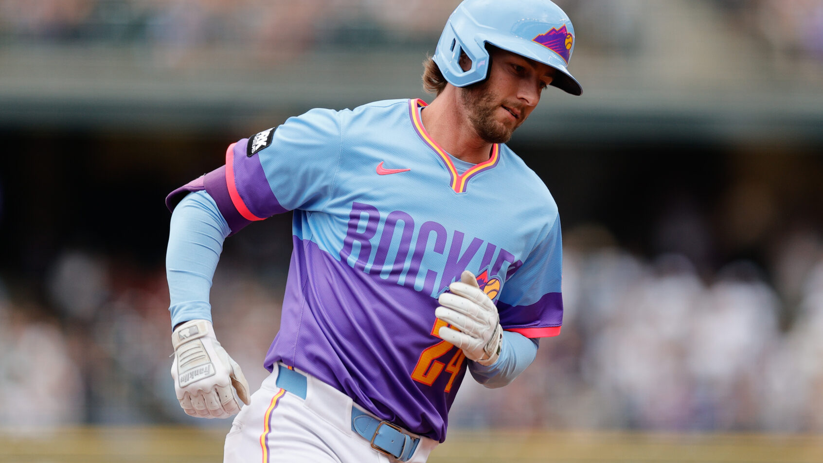 Ryan McMahon rounds the bases after hitting a home run