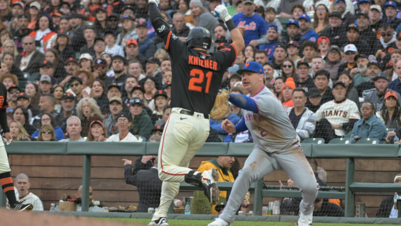 New York Mets first baseman Pete Alonso tries to tag San Francisco Giants catcher Andrew Knizner