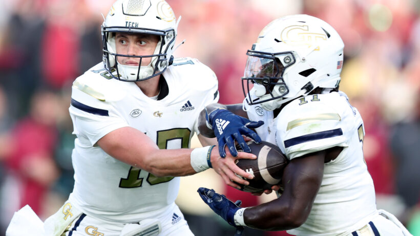 Georgia Tech quarterback Haynes King hands the ball off to Jamal Haynes