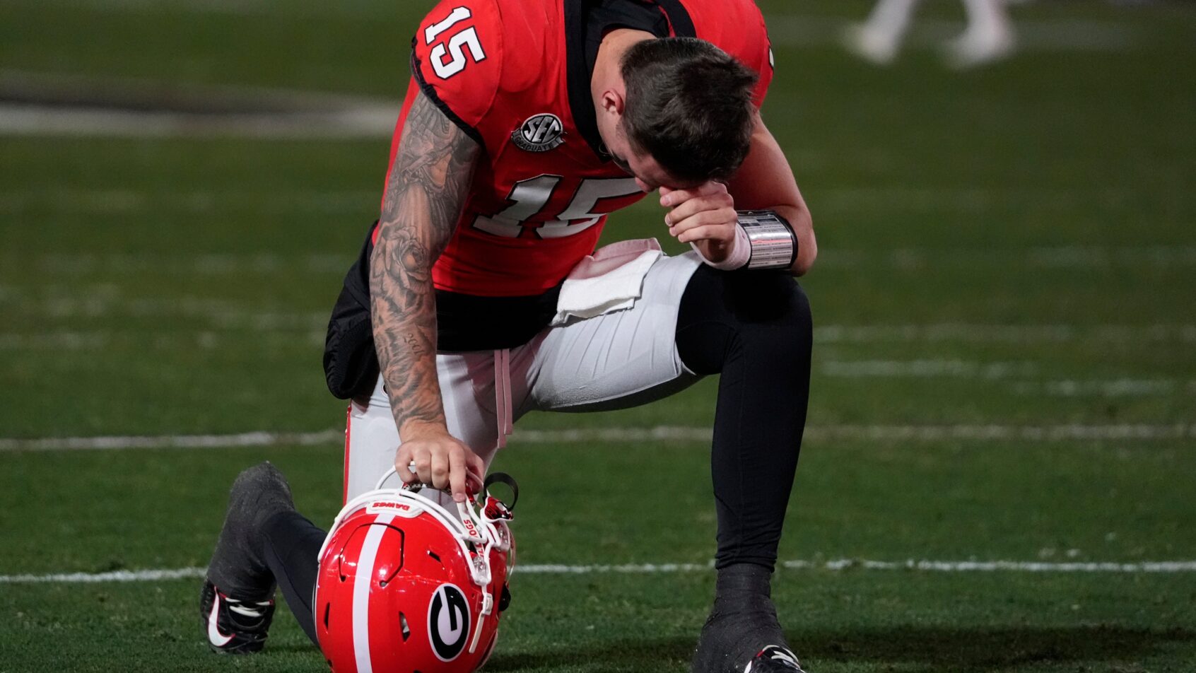 Carson Beck taking a knee