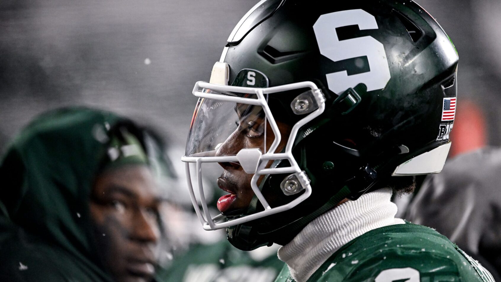 Closeup of Michigan State's Aidan Chiles on the sidleine