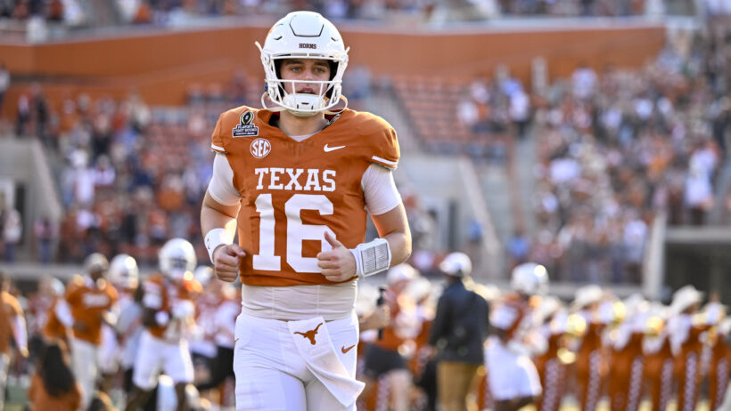 Arch Manning runs onto the field before a playoff game vs Clemson.