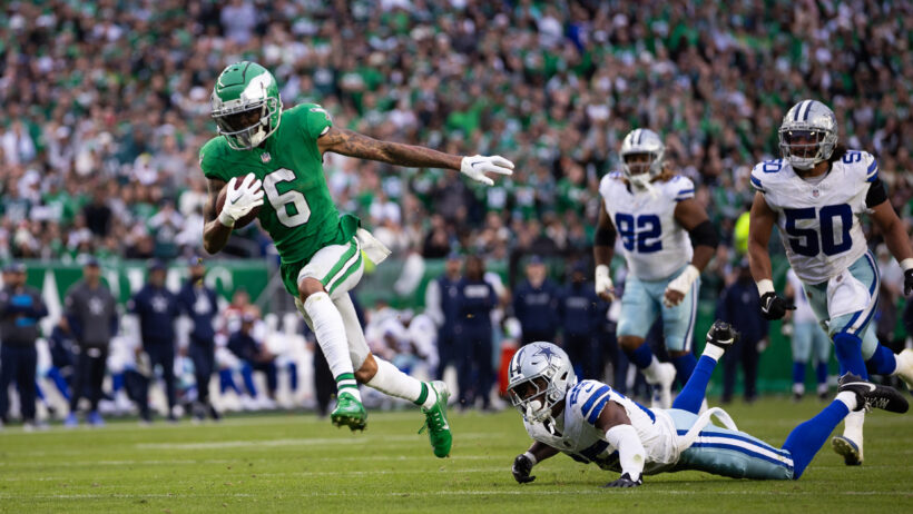 Philadelphia Eagles wide receiver DeVonta Smith runs away from a trio of Dallas Cowboys defenders