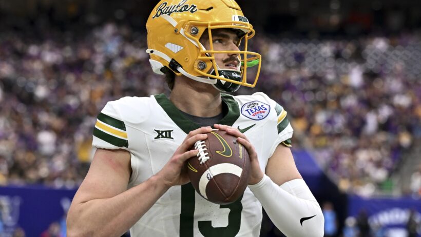 Sawyer Robertson gripping football