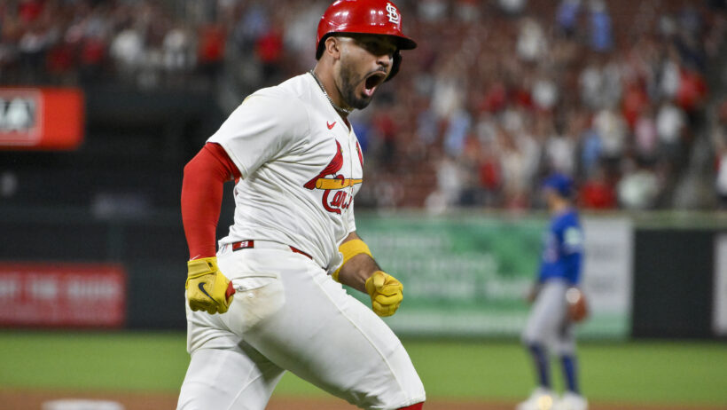 Ivan Herrera reacts after hitting a home run