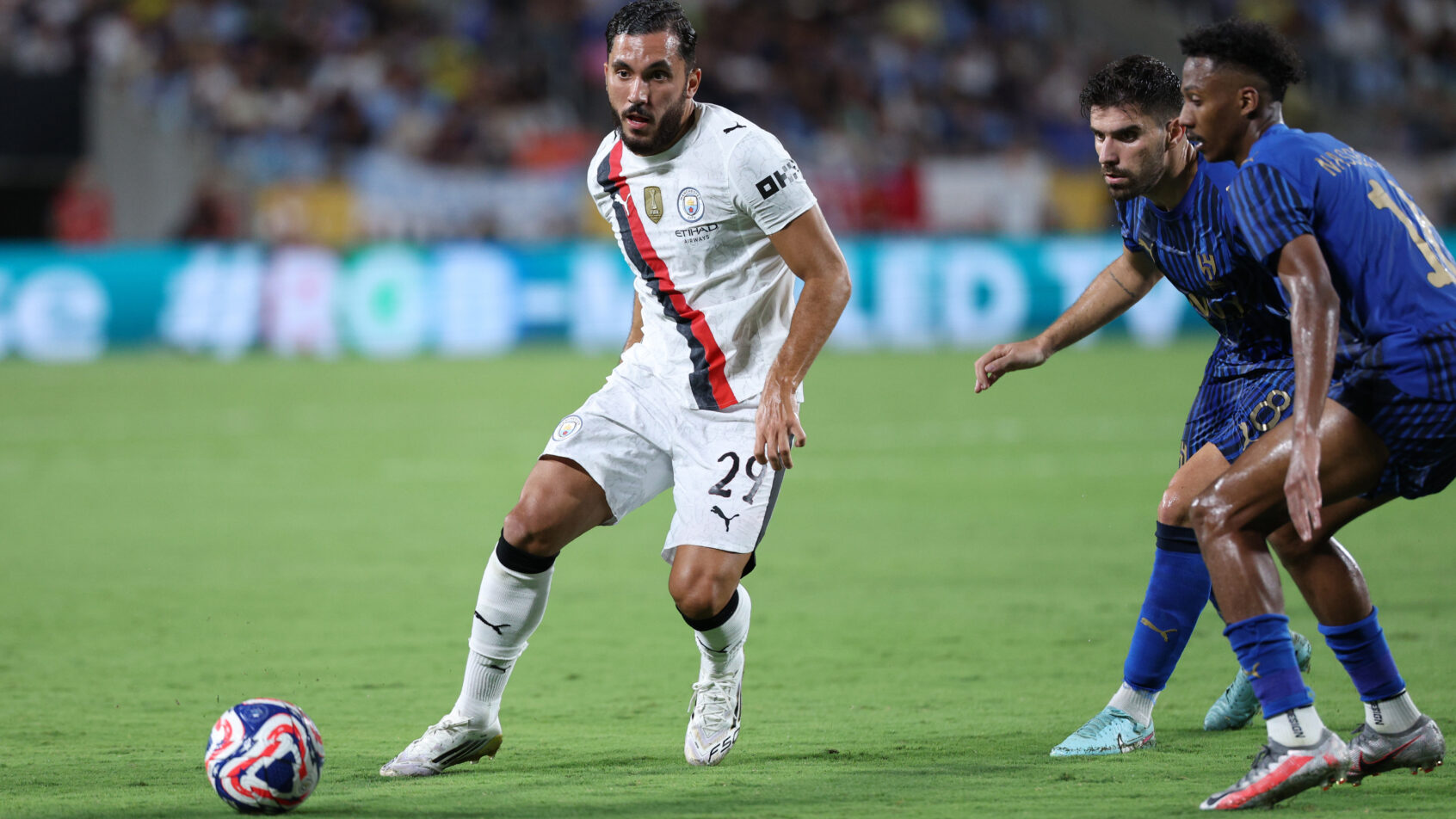 Rayan Cherki tries to elude a Al Hilal defender during the 2025 FIFA Club World Cup.