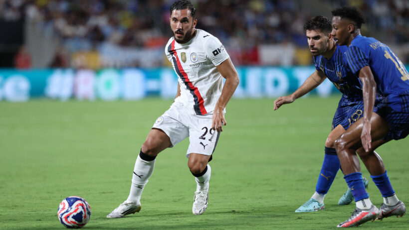 Rayan Cherki tries to elude a Al Hilal defender during the 2025 FIFA Club World Cup.
