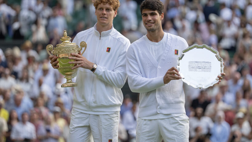 Carlos Alcaraz of Spain and Jannik Sinner of Italy pose with their trophies