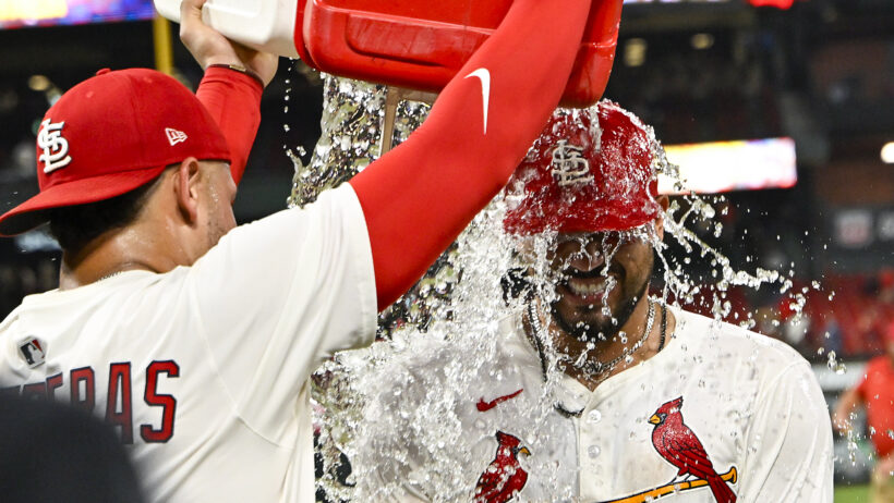 Ivan Herrera getting water dumped on him after winning the game