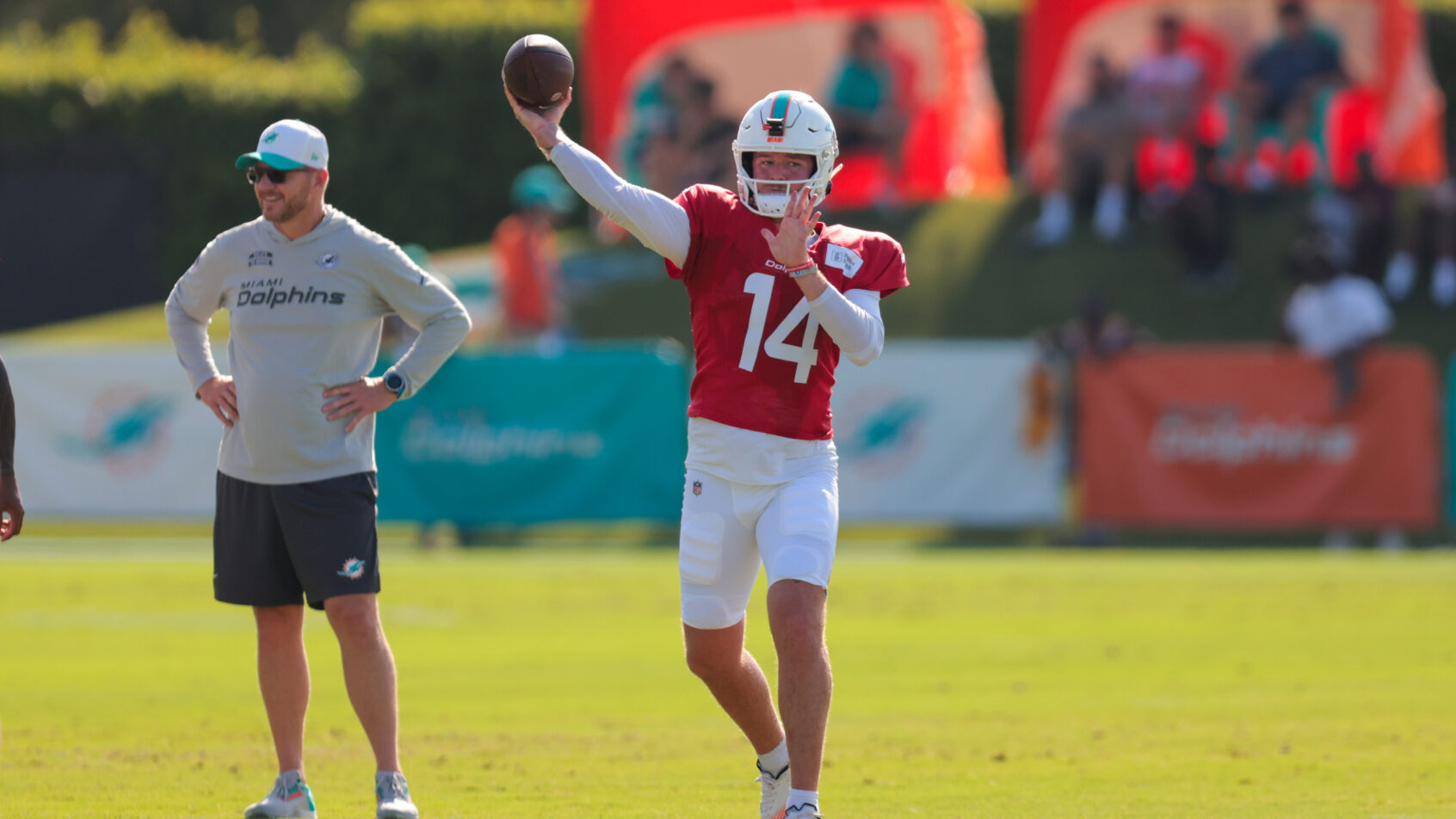 Miami Dolphins quarterback Quinn Ewers throwing a pass during training camp