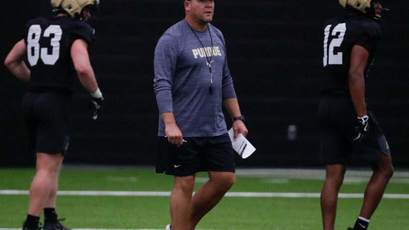 Purdue Boilermakers head coach Barry Odom walks down field
