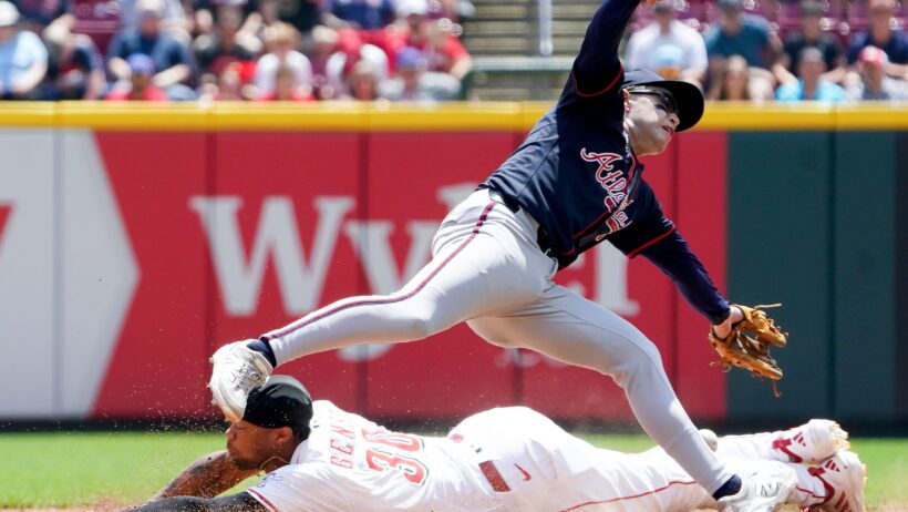 Cincinnati Reds center fielder Will Benson slides into second as Atlanta Braves shortstop Nick Allen covers the base