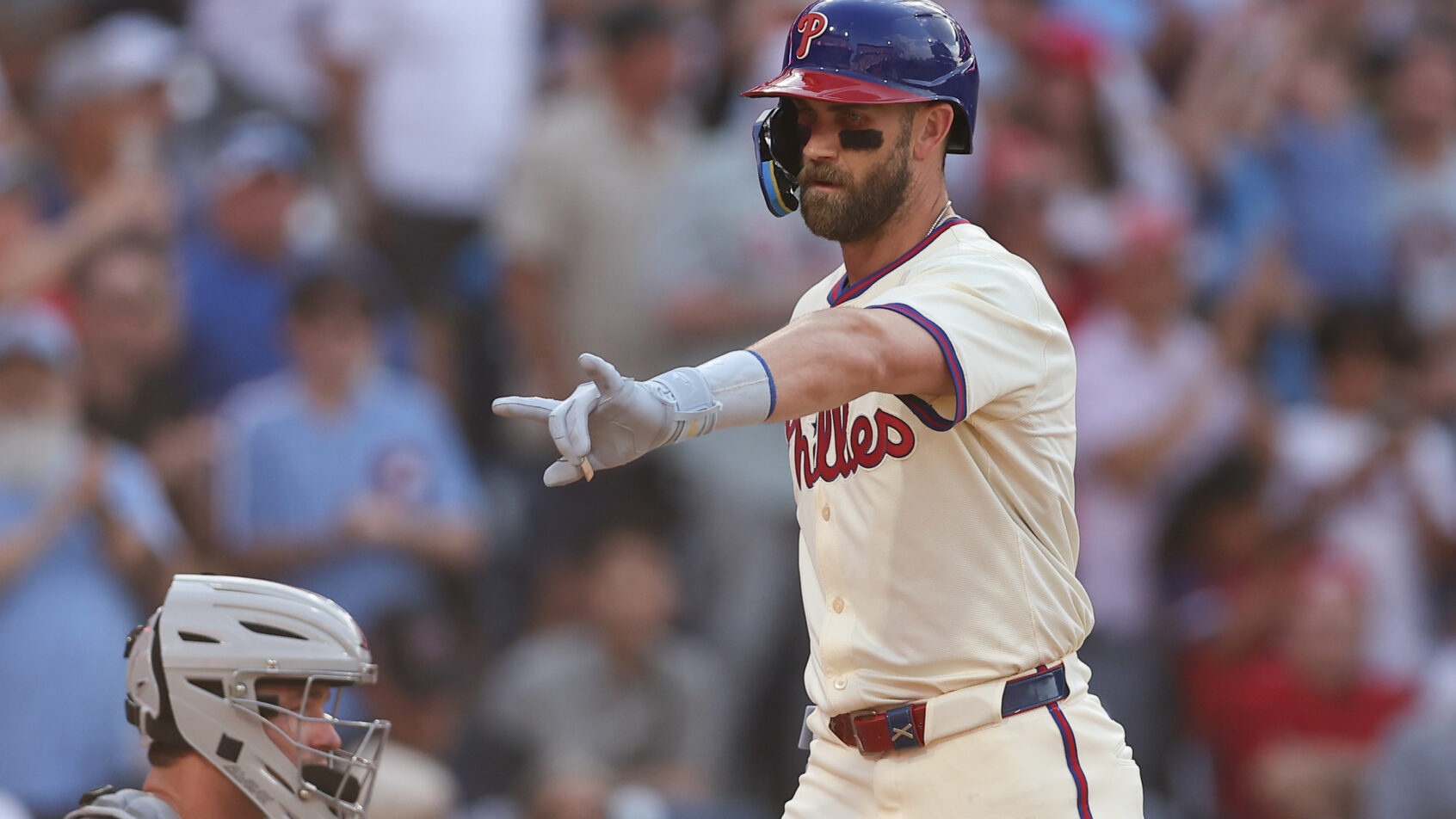 Philadelphia Phillies first base Bryce Harper crosses home plate after hitting a homer against the Detroit Tigers