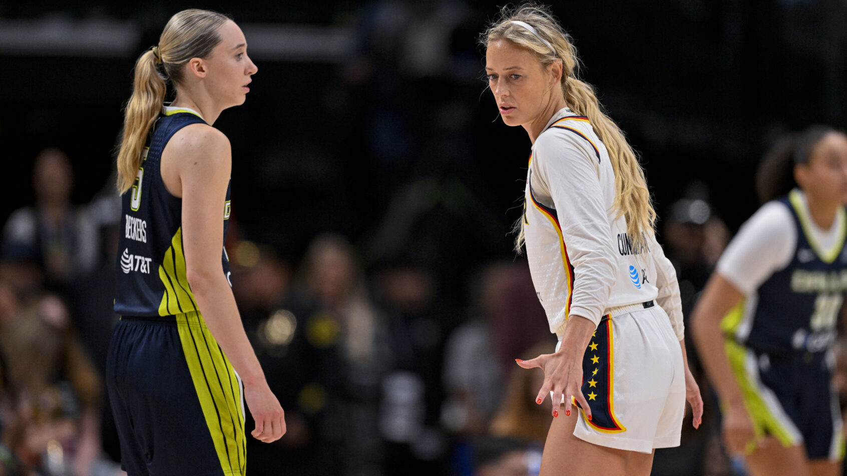 Dallas Wings guard Paige Bueckers and Indiana Fever guard Sophie Cunningham on the court
