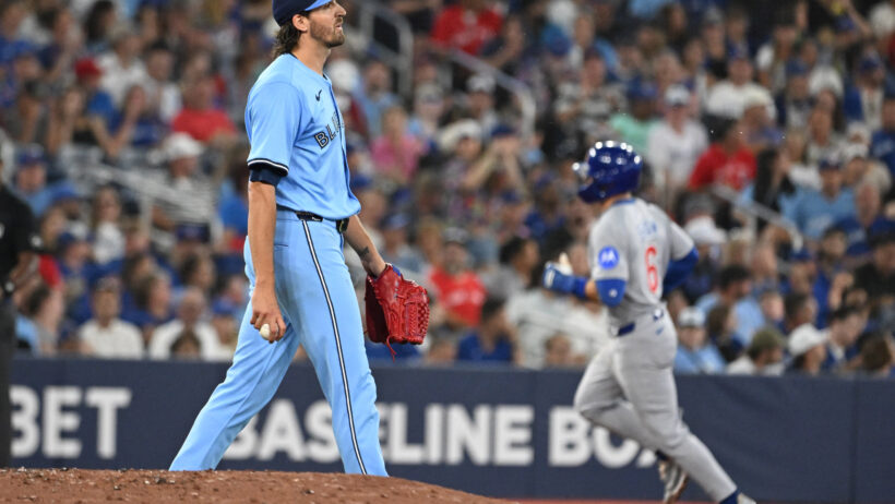 Toronto Blue Jays pitcher Kevin Gausman walks around the mound Chicago Cubs third baseman Matt Shaw rounds the bases
