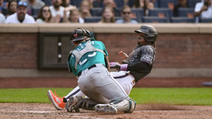 New York Mets shortstop Francisco Lindor tagged out at home by Seattle Mariners catcher Cal Raleigh