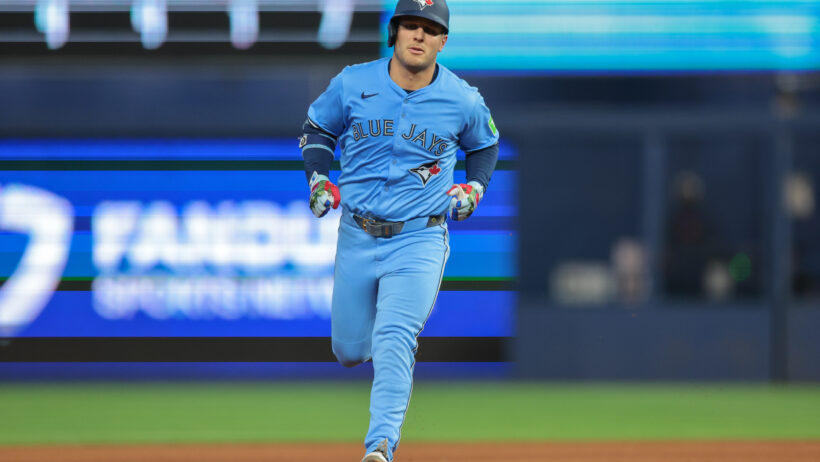 Daulton Varsho rounding the bases after hitting a home run