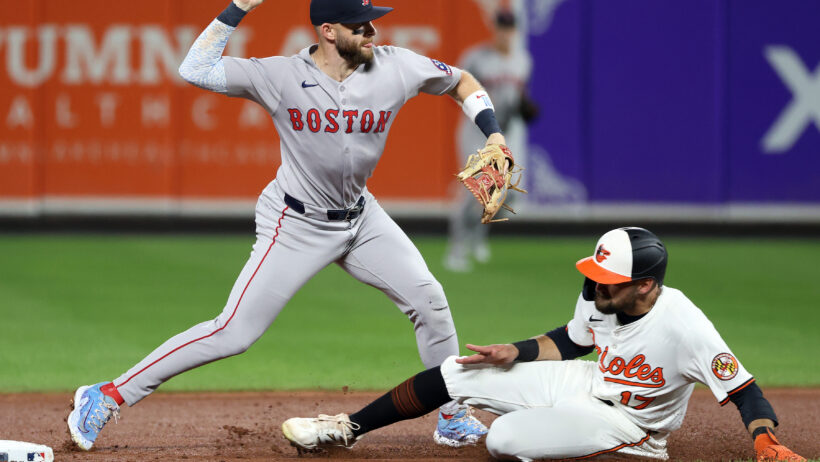 Boston Red Sox shortstop Trevor Story turning a double play against the Baltimore Orioles