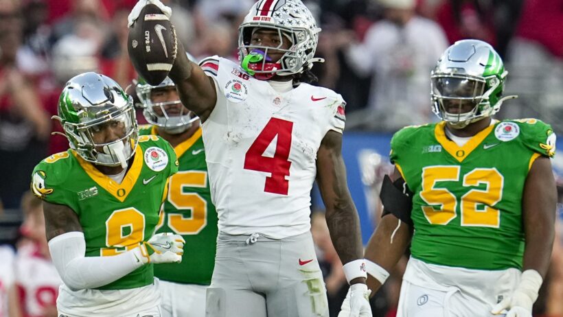 Jeremiah Smith celebrates a first down catch vs Oregon.