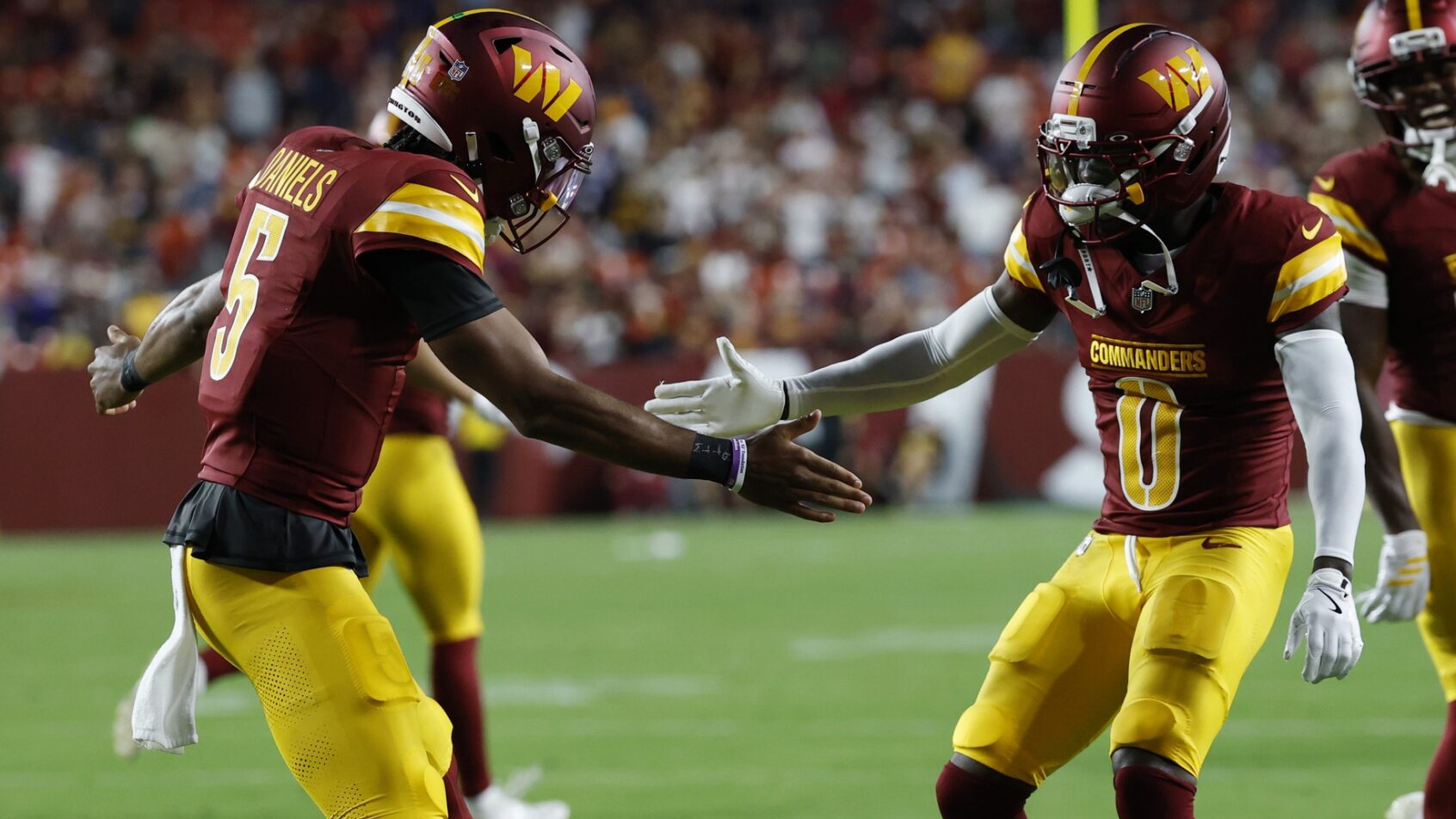 NFL betting apps for Week 1. Jayden Daniels and Mike Sainristil celebrate