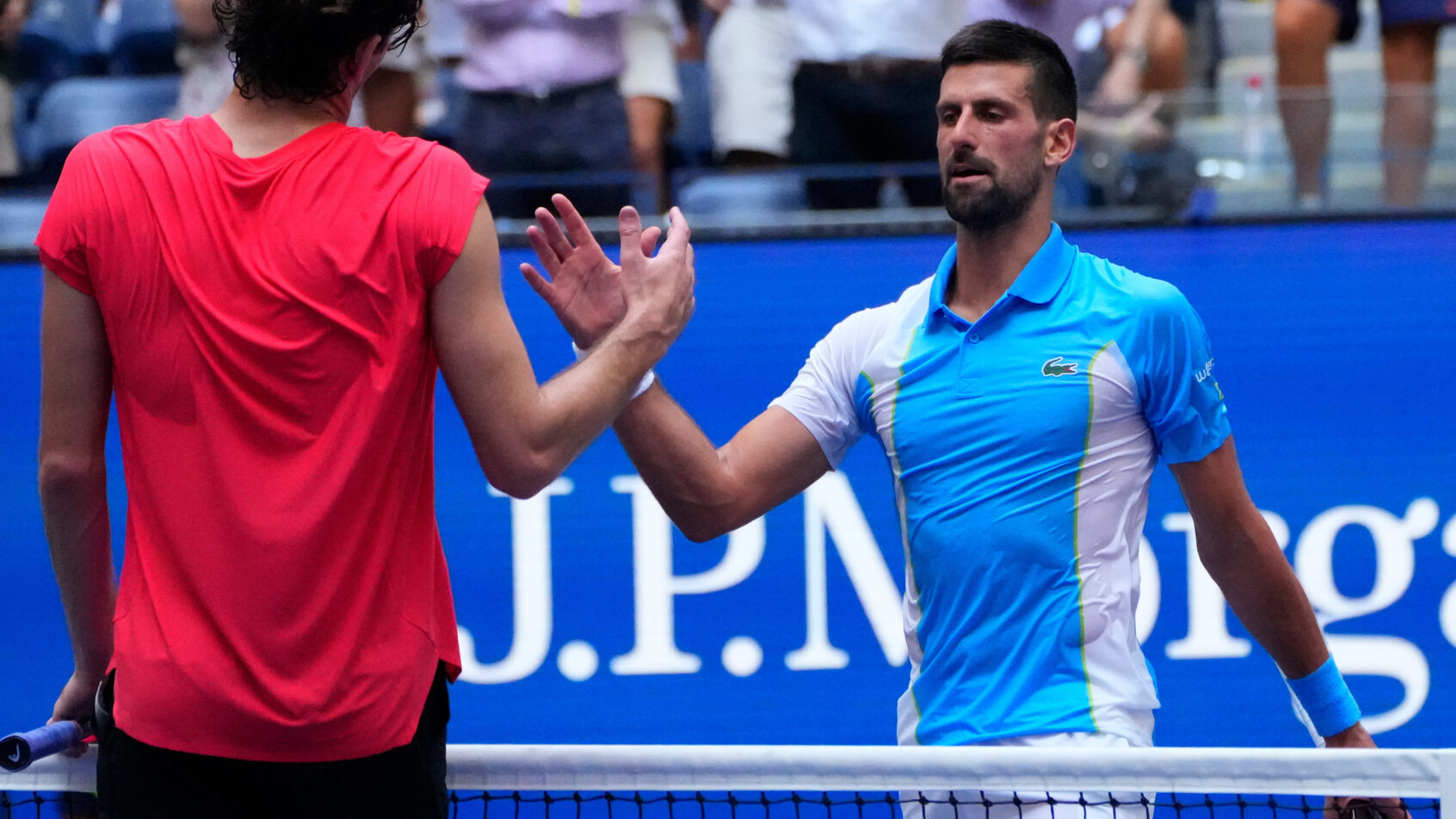 Novak Djokovic and Taylor Fritz shaking hands after a match