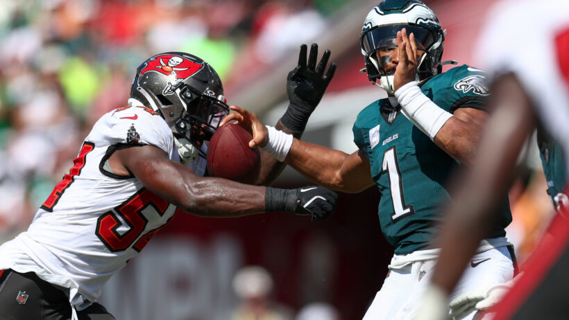 Tampa Bay Buccaneers linebacker Lavonte David hits Philadelphia Eagles quarterback Jalen Hurts as he throws a pass